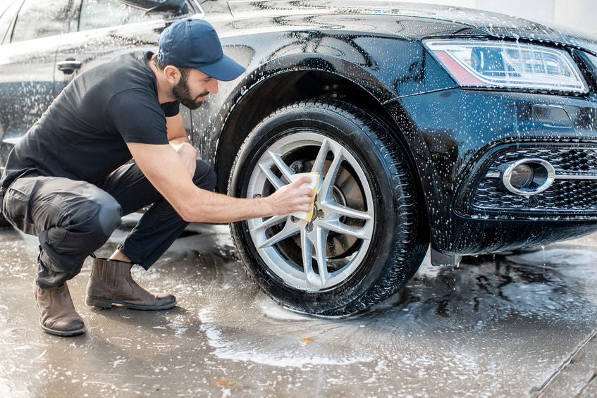 man utilizing best tire shine and cleaning methods